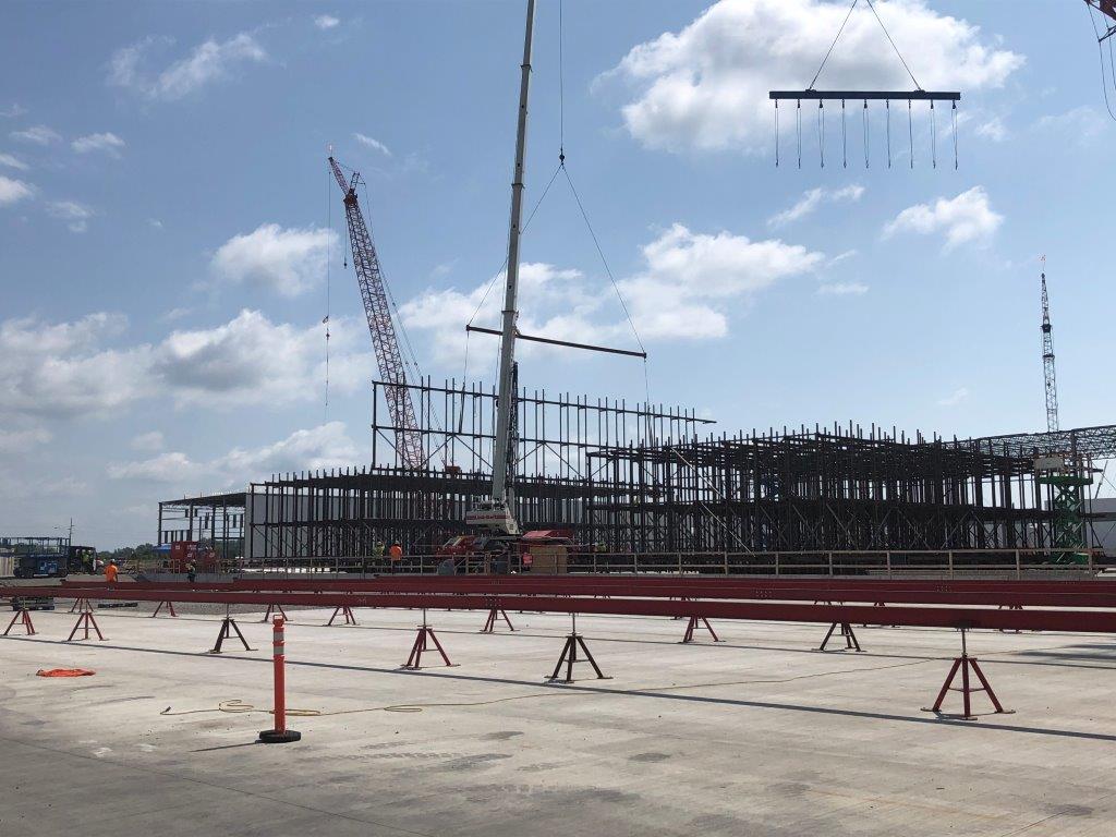 a group of people standing on top of a pier